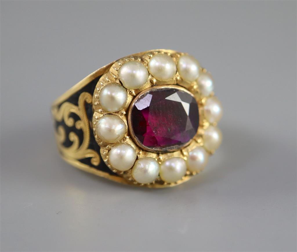 A George IV gold, black enamel, oval cut foil backed garnet and split pearl cluster set mourning ring,